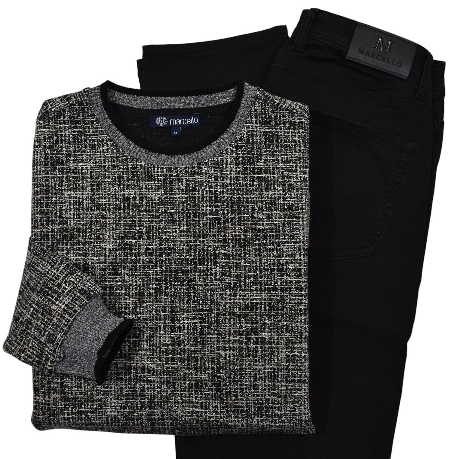 This classic crew neck sweater features a rich combination of tan, ivory, and black, making it the perfect addition to any outfit in the black or tan families.