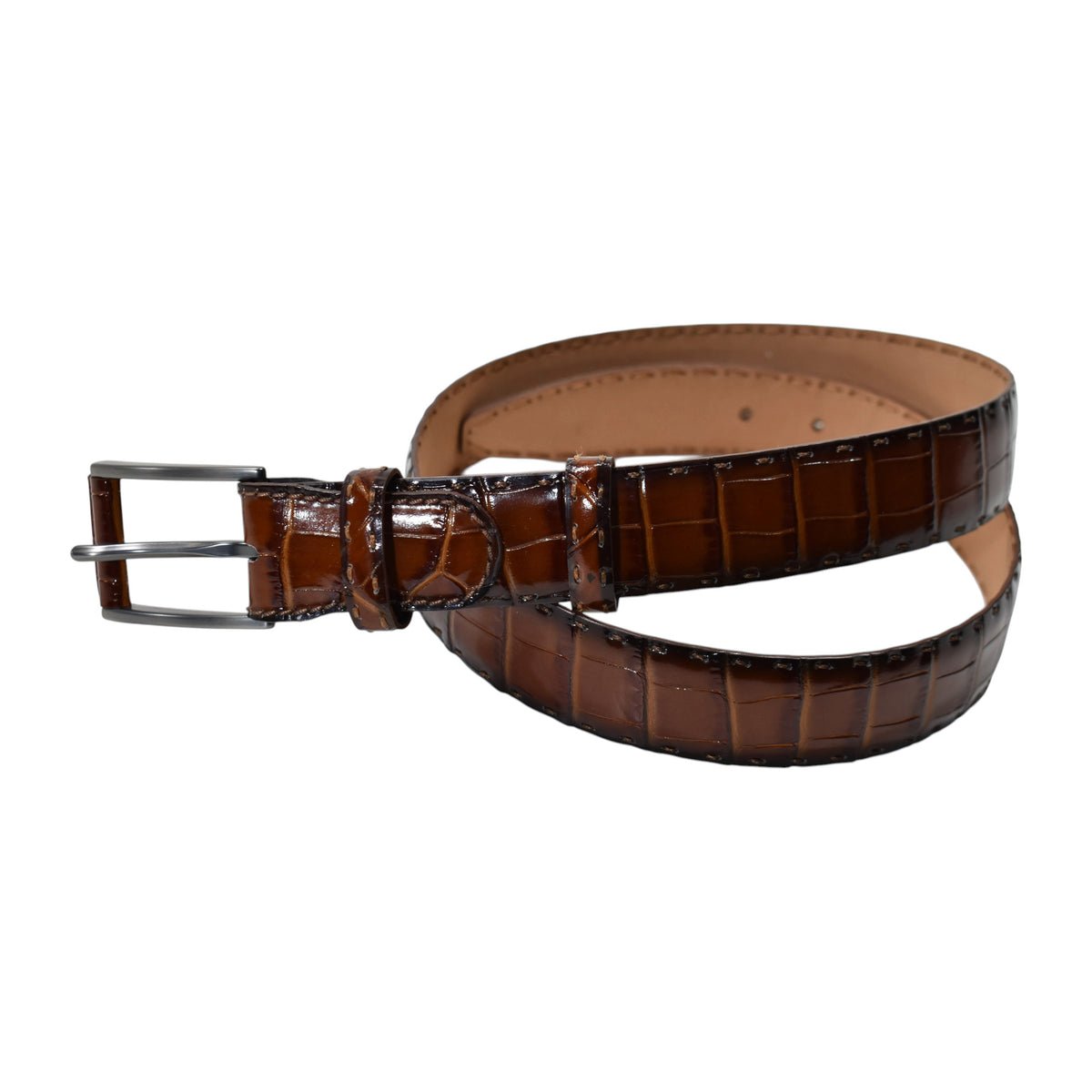 A Marcello Mocha Brown crocodile-embossed leather belt with a silver-tone metal buckle, coiled on a plain white background.