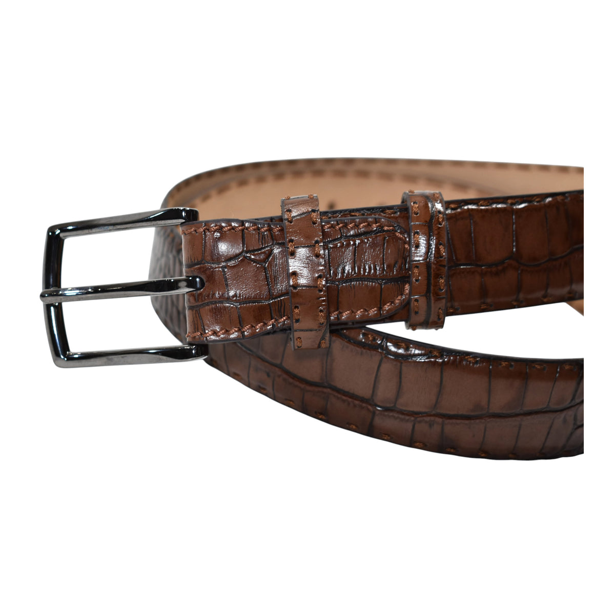 A Marcello Mocha Brown crocodile-embossed leather belt with a silver-tone metal buckle, coiled on a plain white background.