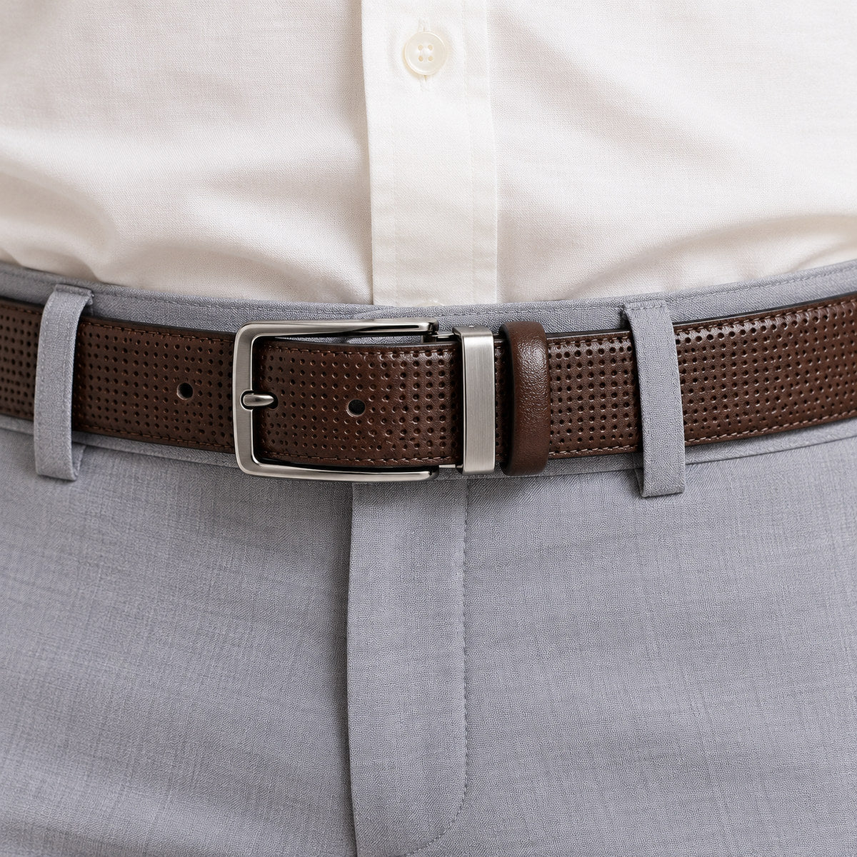 Finely perforated belt, extra fine leather for a classic, yet updated style. Black or Chocolate. By Marcello Sport. Finely perforated fashion pattern. Excellent with your favorite jeans or pants. Black or Chocolate. Satin Nickel Finished Buckle. Slightly wider to provide a better jeans image. Premium leather. Sizes 32-44.