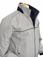 Marcello tan windbreaker reverses to navy.