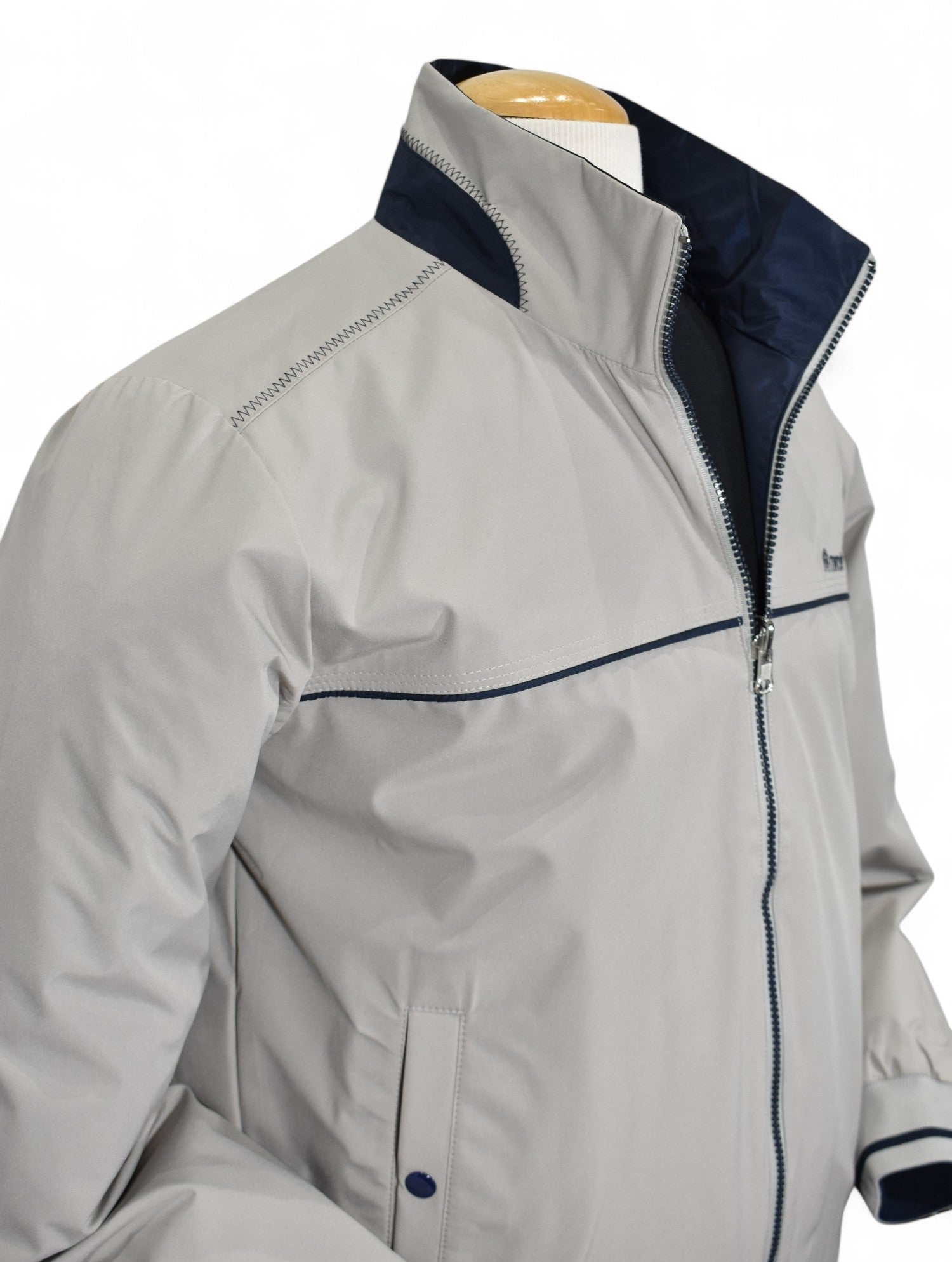Marcello tan windbreaker reverses to navy.