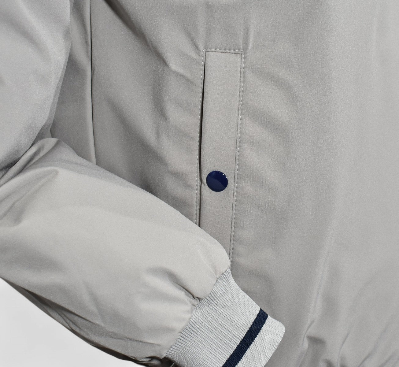 Marcello tan windbreaker reverses to navy.