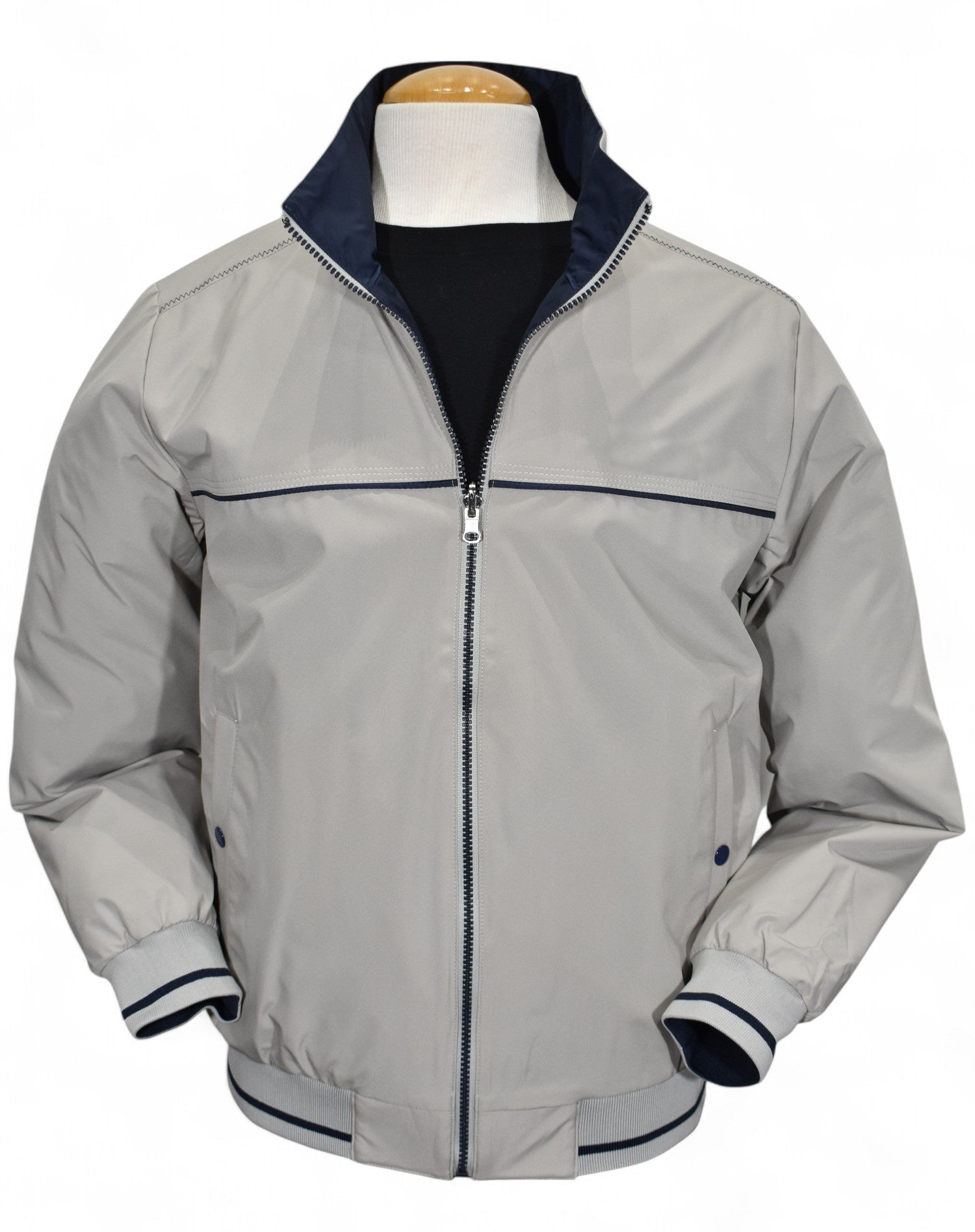 Marcello tan windbreaker reverses to navy.