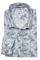 This shirt features a blend of soft cotton and linen, with a timeless blue check pattern and a striking abstract floral print. By Marcello