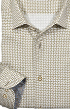 Upgrade your wardrobe with the W031R Tan Andrew Roll Collar. Crafted from extra fine cotton with a luxurious silk-like finish, this shirt is a dream to wear. The Marcello exclusive one-piece roll collar stands elegantly, while the custom matched buttons and trim fabric add a touch of sophistication.