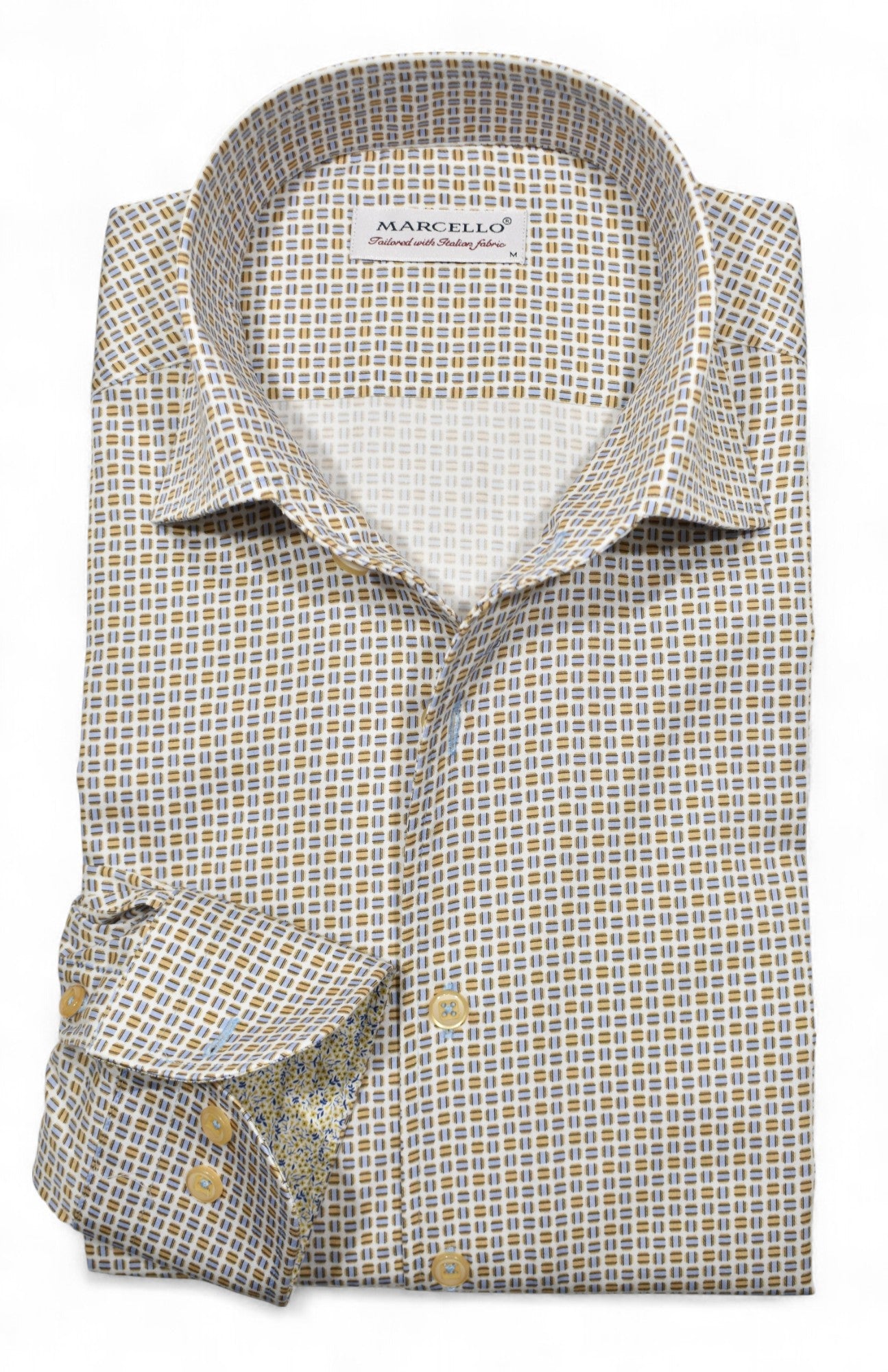 Marcello tans and blue shirt.