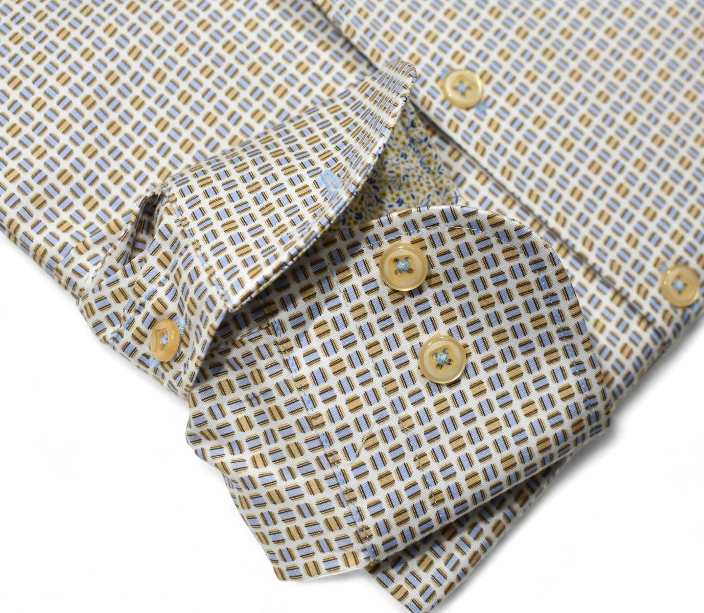 Marcello tans and blue shirt.