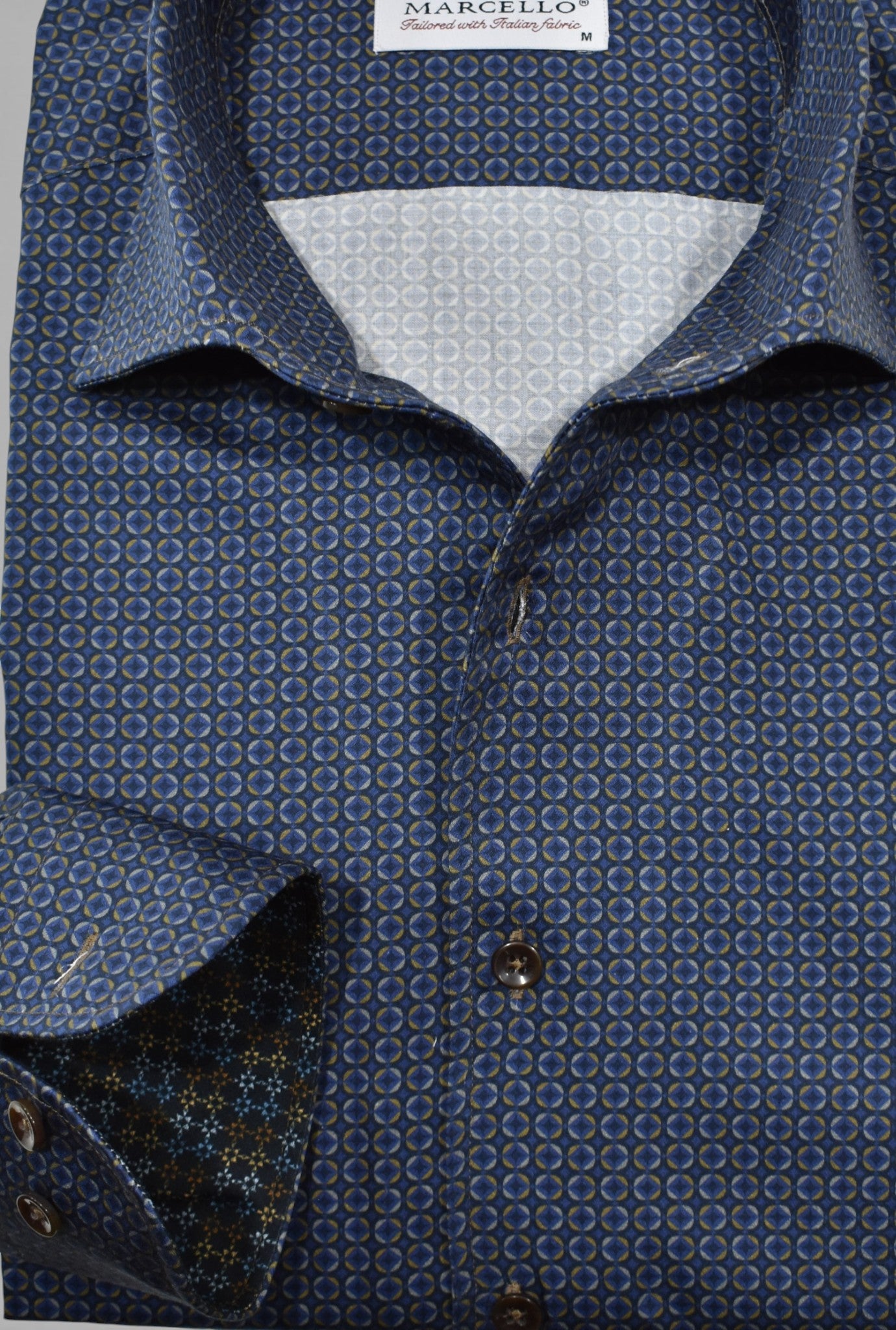 Navy Marcello shirt with round medallions.