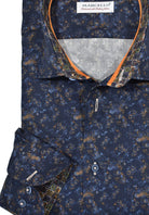 A great way to elevate your wardrobe with effortless style. Featuring a navy cotton fabric with an elegant abstract print, the W730 Whisp Abstract Print looks amazing tucked or untucked, perfectly complemented by slim trim fabric, a striking orange neck trim and well-matched buttons. Enjoy a classic shaped fit. by Marcello