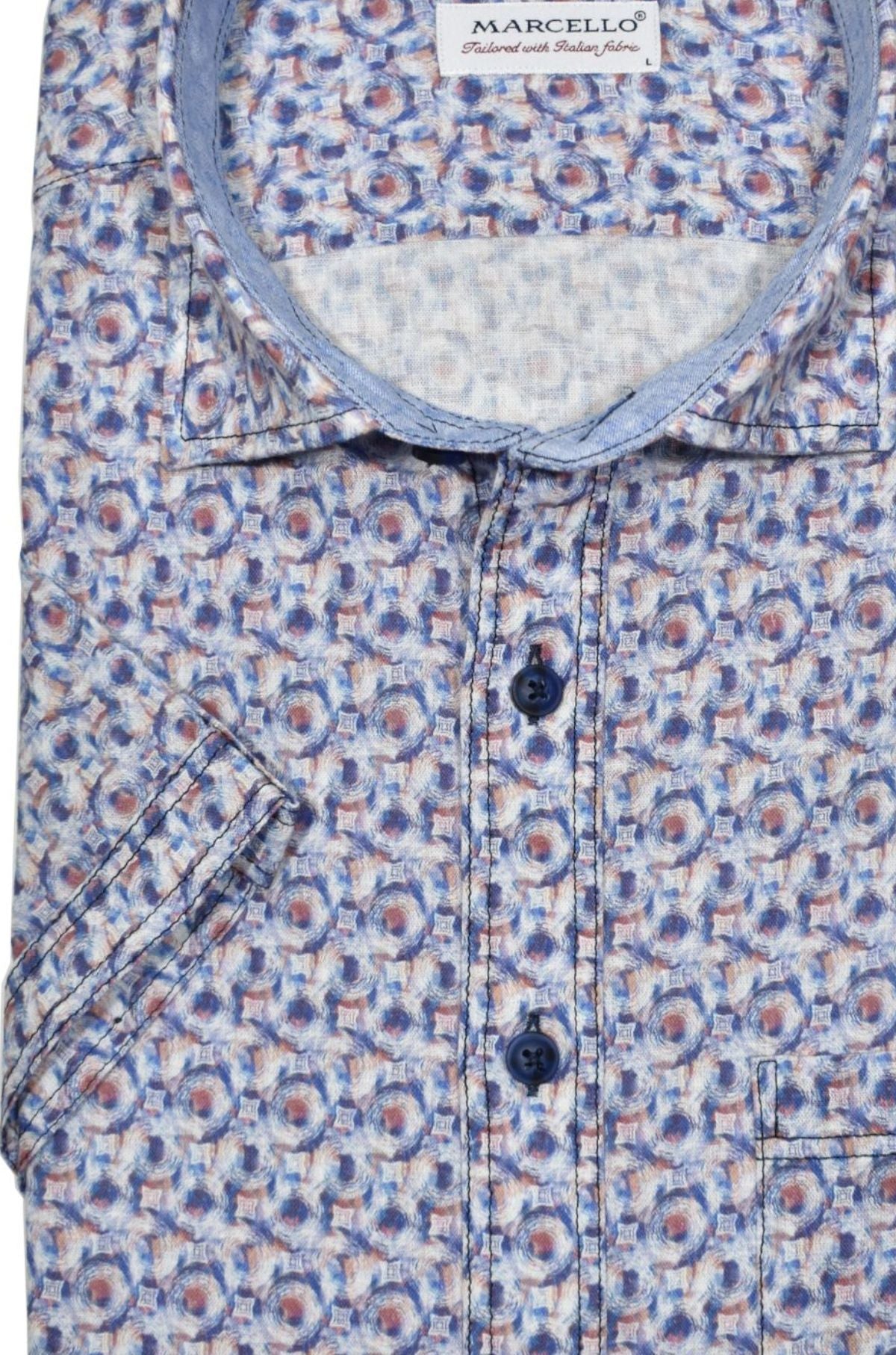 Look stylish and feel comfortable in this Missuni Print Sport Shirt. Crafted from soft materials, it features a contemporary warm-toned print pattern, contrast navy stitch detailing, a soft collar and classic chest pocket - the perfect blend of fashion and function.