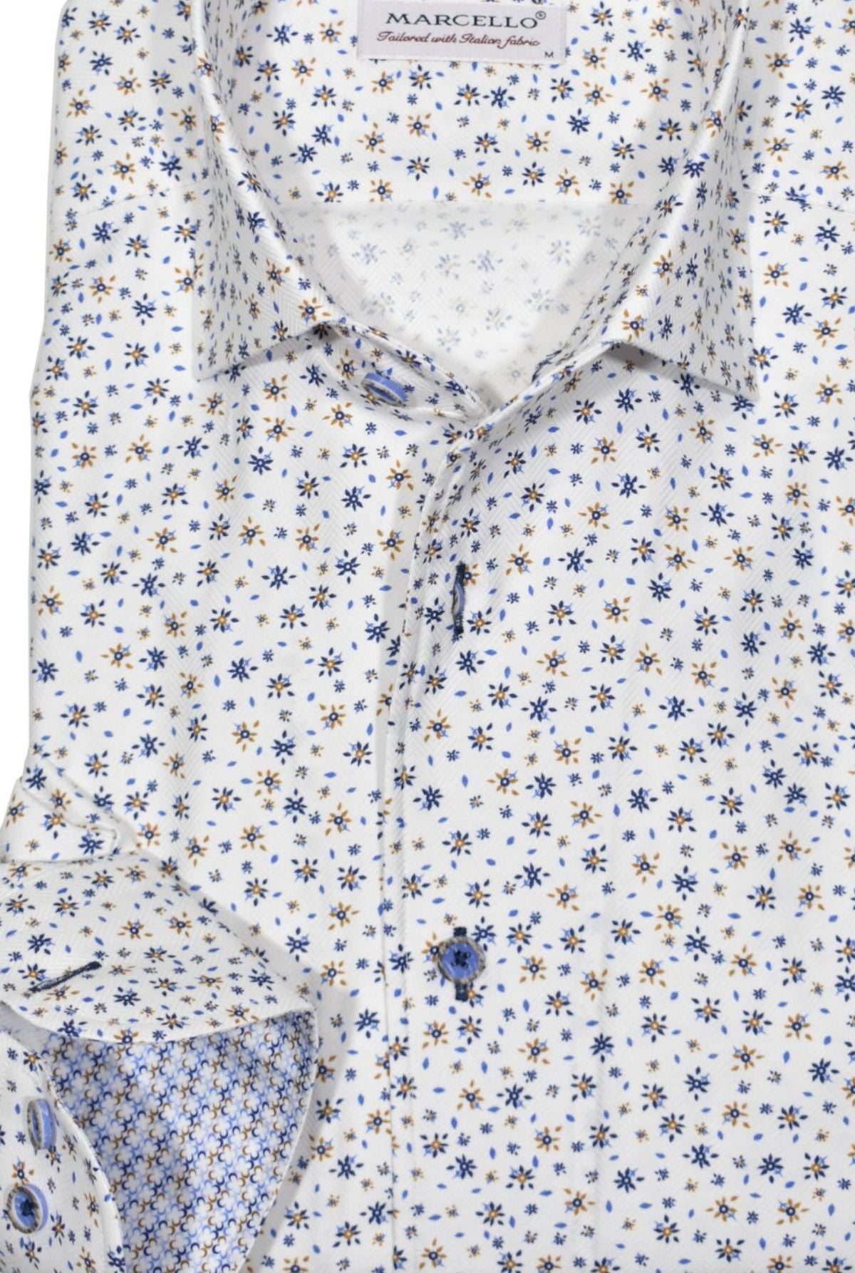 This soft herringbone shirt boasts a subtle micro floral pattern in navy and camel, making it a stylish addition to any wardrobe. Shirt by Marcello.