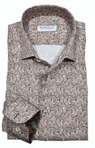 Elevate your style with the Marcello Tan Paisley Roll Collar. Our exclusive one piece roll collar provides a polished look, whether worn alone or under a sport coat. In soft shades of tan, mocha, and gray, this paisley pattern adds a touch of sophistication to any outfit.