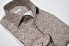 Elevate your style with the Marcello Tan Paisley Roll Collar. Our exclusive one piece roll collar provides a polished look, whether worn alone or under a sport coat. In soft shades of tan, mocha, and gray, this paisley pattern adds a touch of sophistication to any outfit.