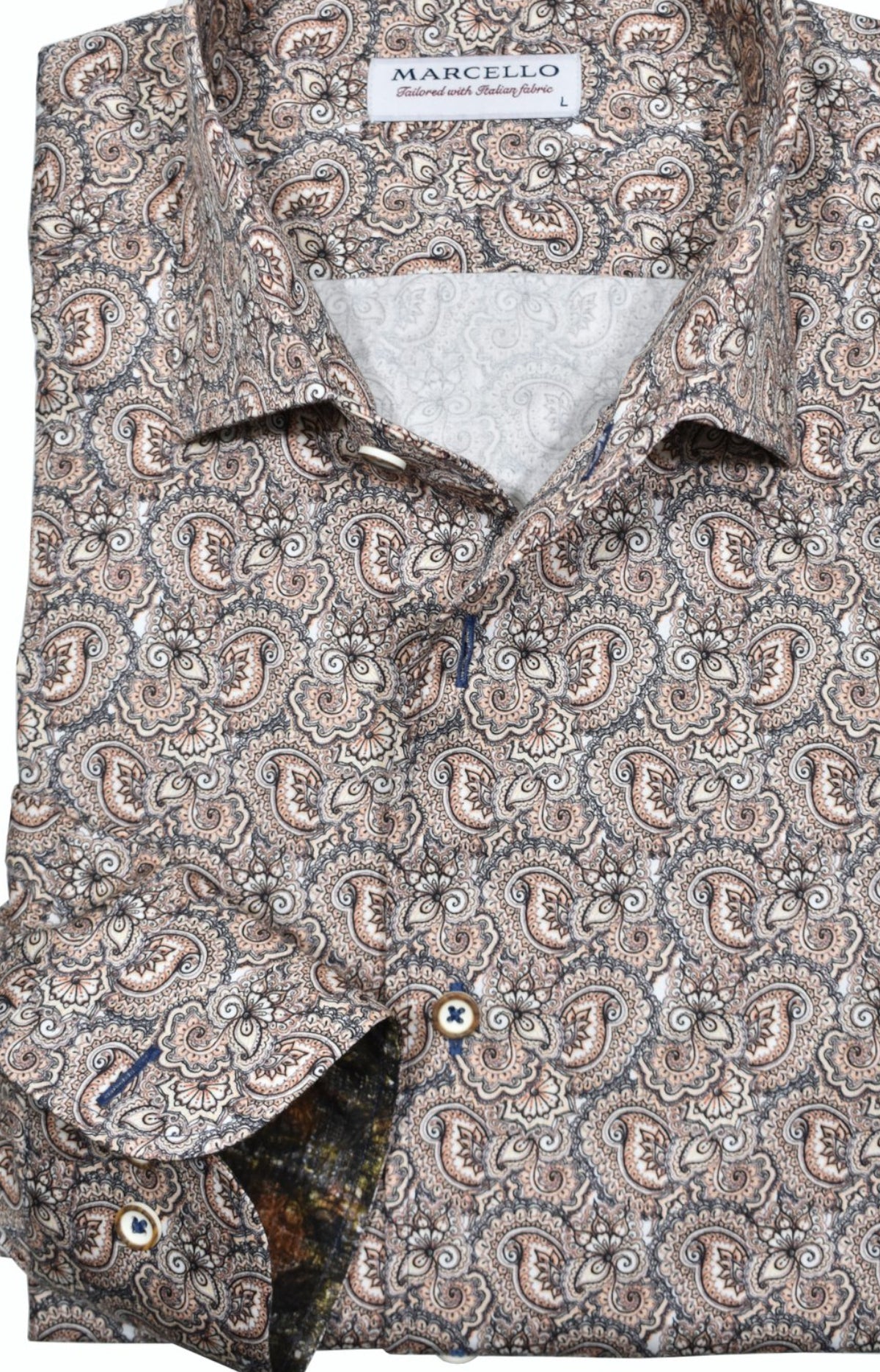 Elevate your style with the Marcello Tan Paisley Roll Collar. Our exclusive one piece roll collar provides a polished look, whether worn alone or under a sport coat. In soft shades of tan, mocha, and gray, this paisley pattern adds a touch of sophistication to any outfit.