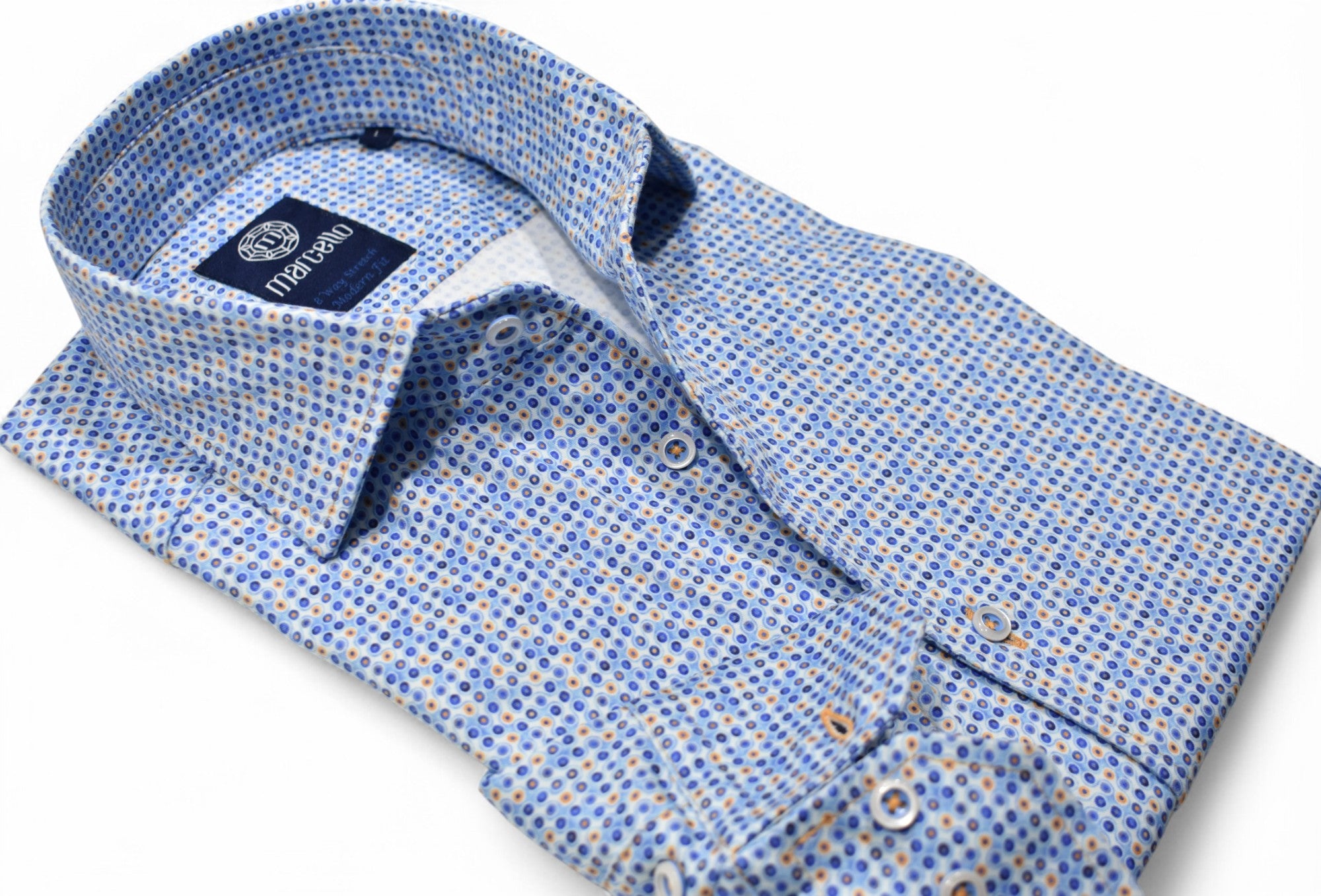 The abstract print of shades of blue with tan accents is soft in nature, yet cool to create a fashion statement. Stretch shirt by Marcello.
