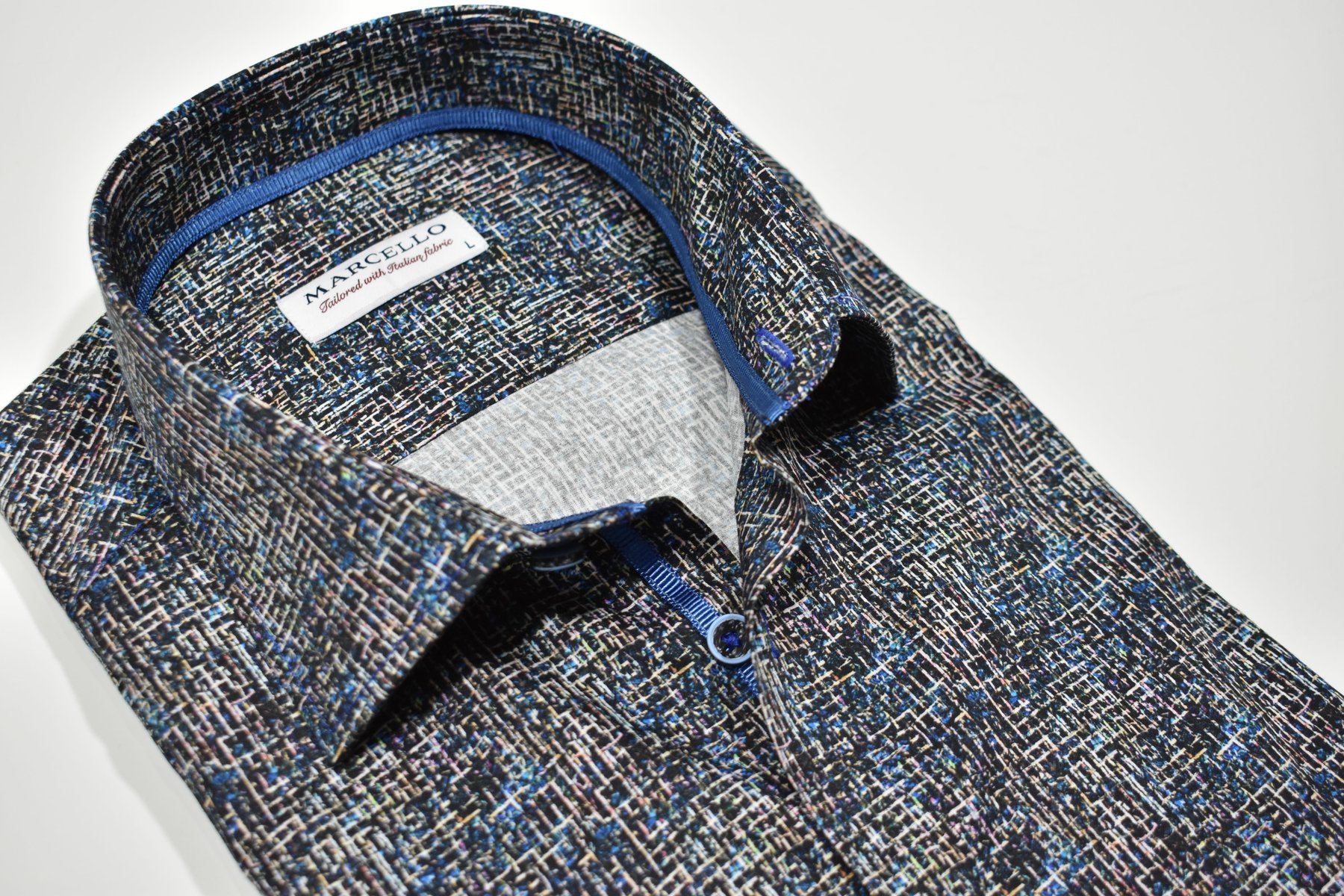 Add a touch of sophistication to your outfit with Marcello's Indigo Black Circuit shirt. The tight circuit pattern in black and white is complemented with royal blue accents, creating a unique abstract design. A sure conversation starter, this shirt is perfect for any occasion.