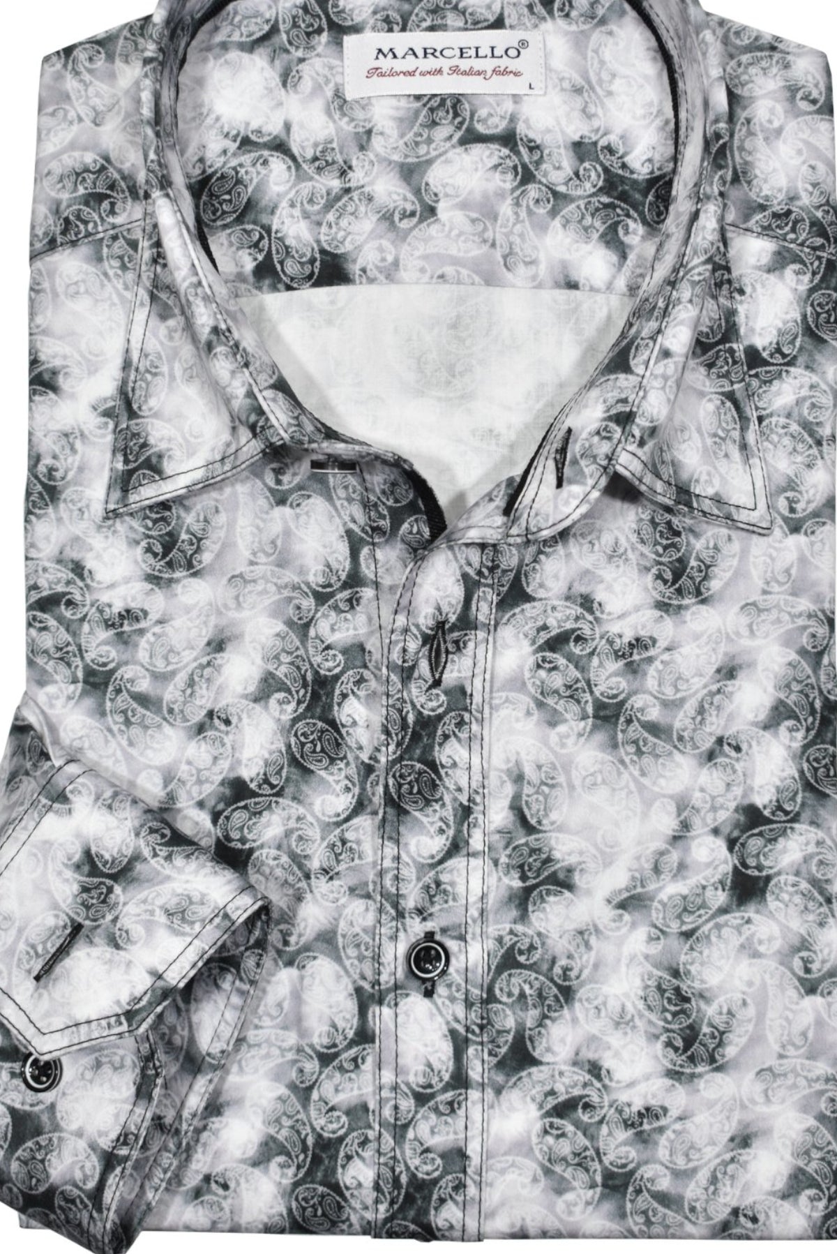 Enhance your contemporary style with the Marcello Slate Paisley. Featuring a unique mix of slate, gray and charcoal tones, and floating white paisleys, this abstract print offers a cool and modern aesthetic.