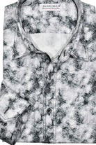 Enhance your contemporary style with the Marcello Slate Paisley. Featuring a unique mix of slate, gray and charcoal tones, and floating white paisleys, this abstract print offers a cool and modern aesthetic.