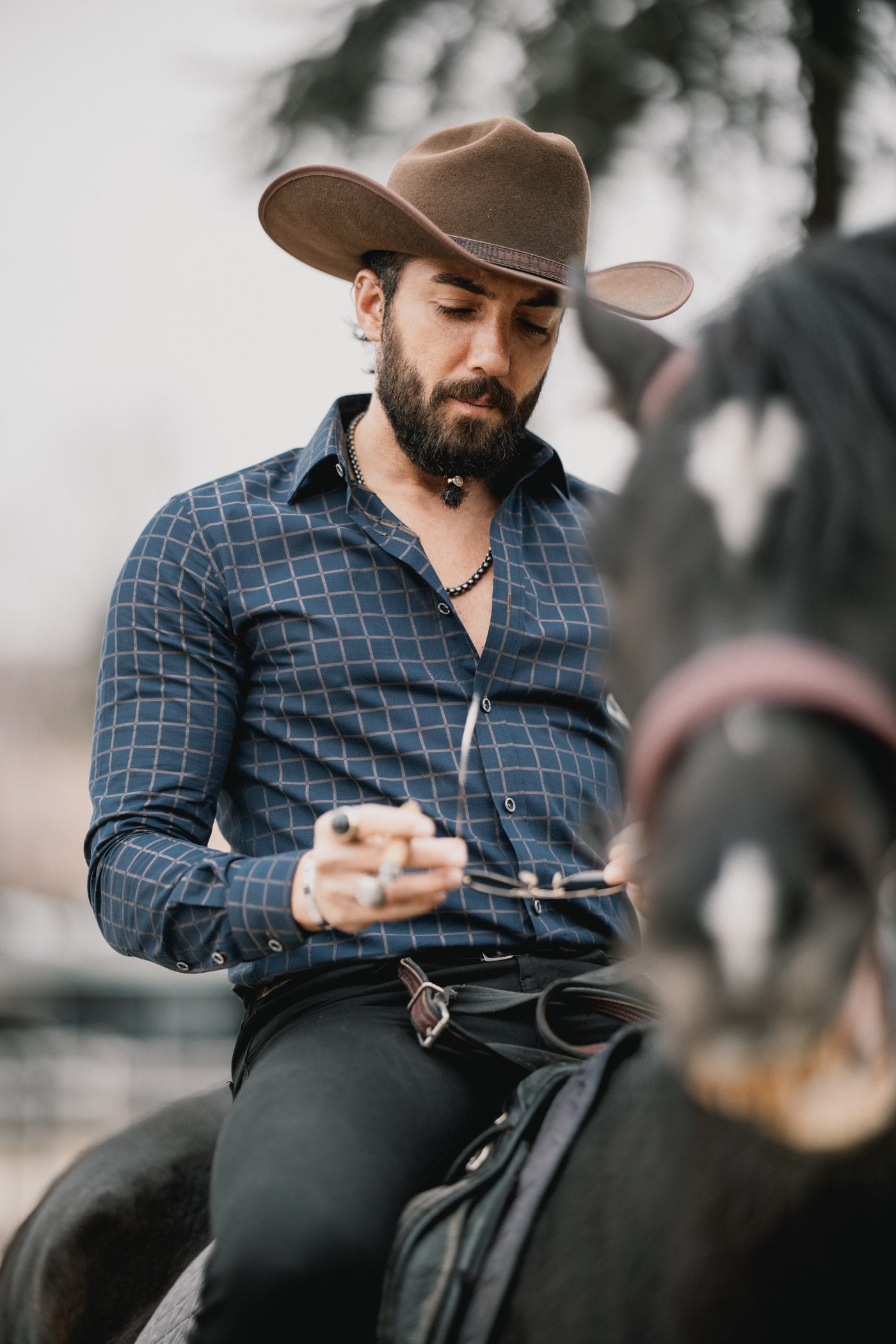 Elevate your style with the Marcello Navy West Clip. The rich navy color and camel window pane pattern add a touch of sophistication to this classic yet contemporary accessory. Perfect if your look is updated traditional, fashion or even Western.