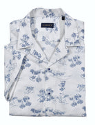 Relax and dream away in a cool casual lifestyle. Made with soft white cotton seersucker fabric and a matching island motif print in warm blue, this shirt brings a cool and comfortable look. Its pajama top collar adds to the relaxed fit, making it perfect for your island getaway.