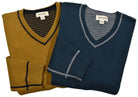 Experience versatility and style with a Cotton Cashmere Reversible sweater. Made with a  luxurious cotton and cashmere blend, this v neck sweater features solid color on one side and classic stripes on the reverse. Detailed with welted seam stitching for a modern touch. Stay cool and fashionable in any setting.