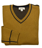 Experience versatility and style with a Cotton Cashmere Reversible sweater. Made with a  luxurious cotton and cashmere blend, this v neck sweater features solid color on one side and classic stripes on the reverse. Detailed with welted seam stitching for a modern touch. Stay cool and fashionable in any setting.
