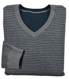 Experience versatility and style with a Cotton Cashmere Reversible sweater. Made with a  luxurious cotton and cashmere blend, this v neck sweater features solid color on one side and classic stripes on the reverse. Detailed with welted seam stitching for a modern touch. Stay cool and fashionable in any setting.