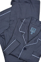 Feel cozy and relaxed in this classic navy flora pajama set. Crafted in soft cotton, this pajama is designed with a coat top with chest pocket and draw string bottoms with stretch waist for optimal comfort. Experience a luxurious night's sleep with the perfect combination of style and comfort.