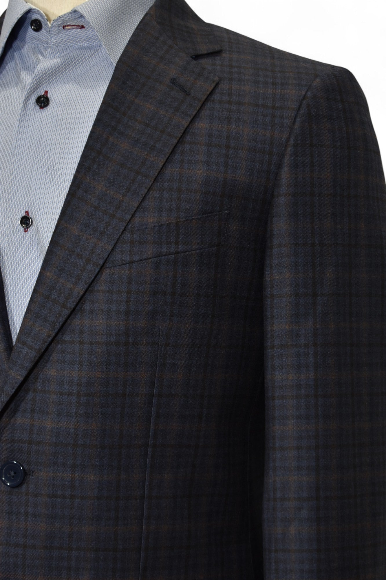 Max Davoli modern fit sport coat. Rich plaid mixing medium blue, gray with a windowpane in charcoal and camel.