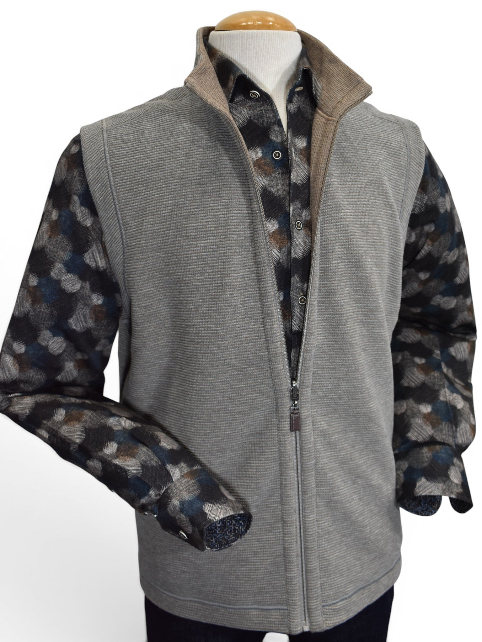 Taupe reverses to camel zip vest.