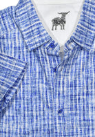 Upgrade your casual wardrobe with our Brushed Plaid Full Button Polo. By Marcello Sport.