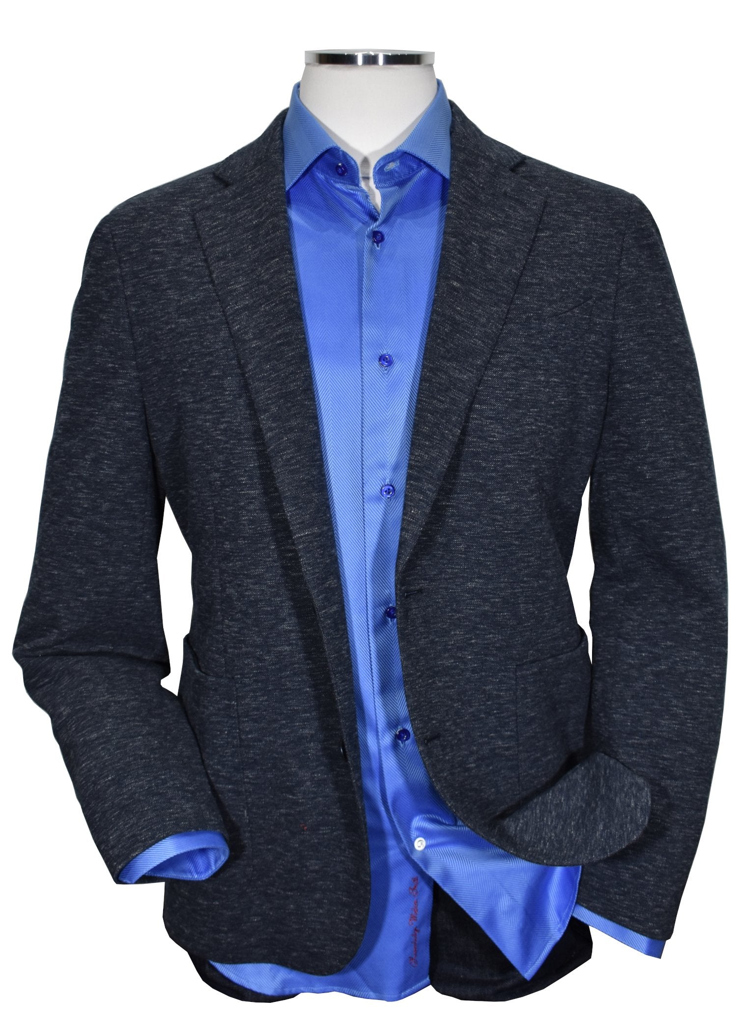 This Marcello Slate Knit Sport Coat is made with a soft knit effect in a rich navy and gray mixed yarn. The result is a cool and stylish look that pairs well with jeans or pants. Perfect for a slim to medium build, this sport coat is modern and versatile, making it a great addition to any wardrobe.