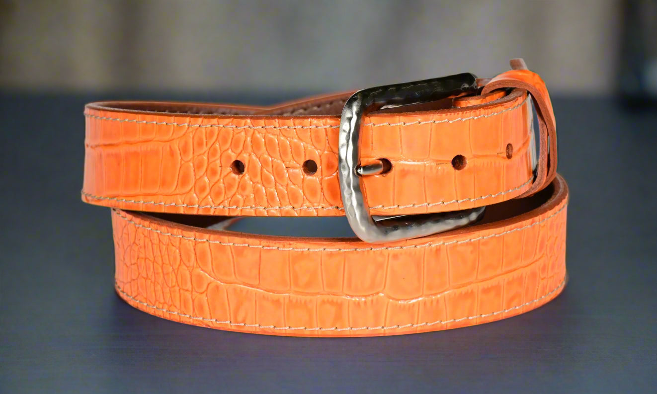 Elevate your style with our luxurious Italian gator embossed calfskin belt in vibrant orange.