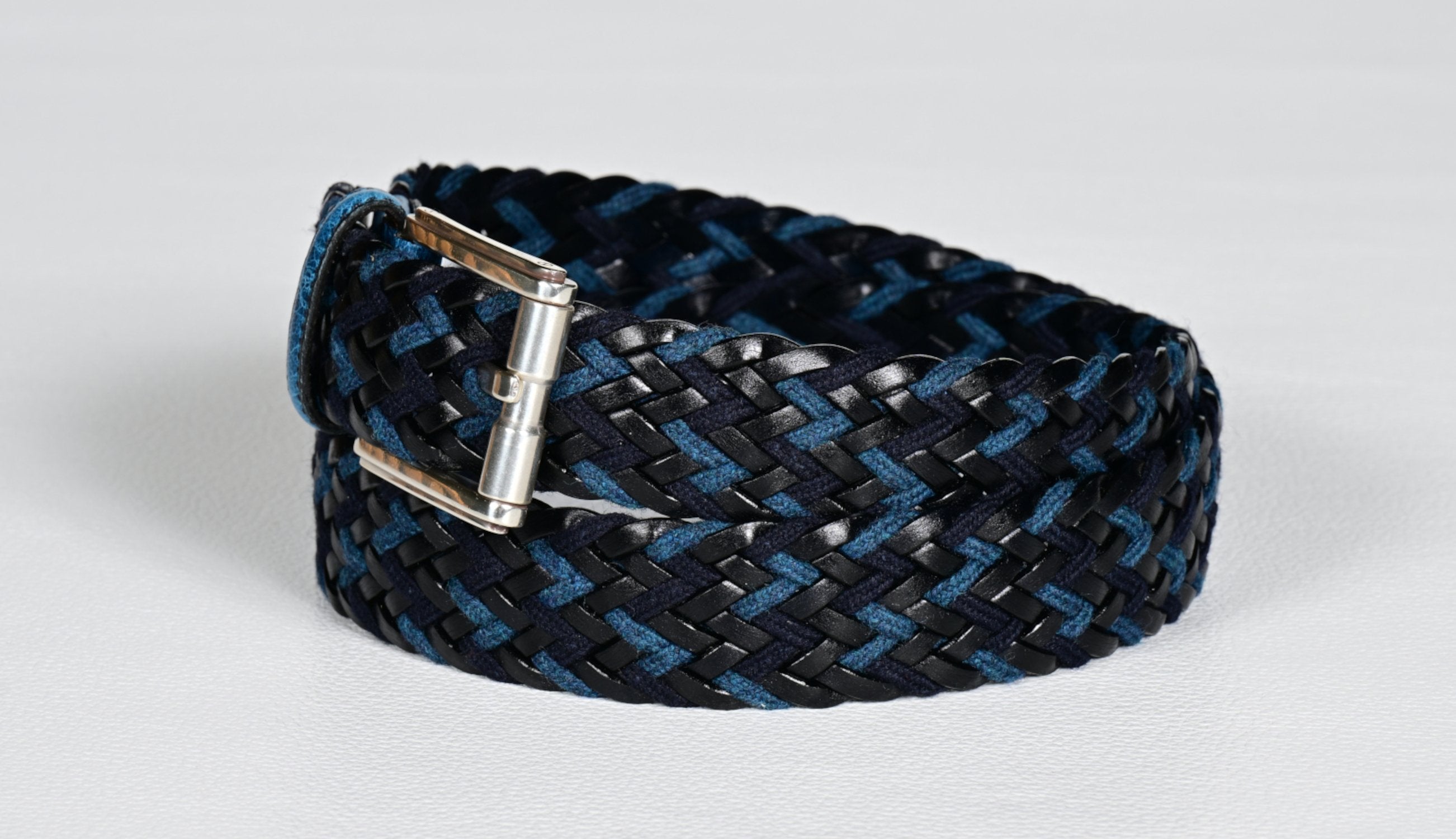 Italian leather and cotton woven in a tall chevron pattern in sharp blue, black and navy colors. Belt offered by Marcello.