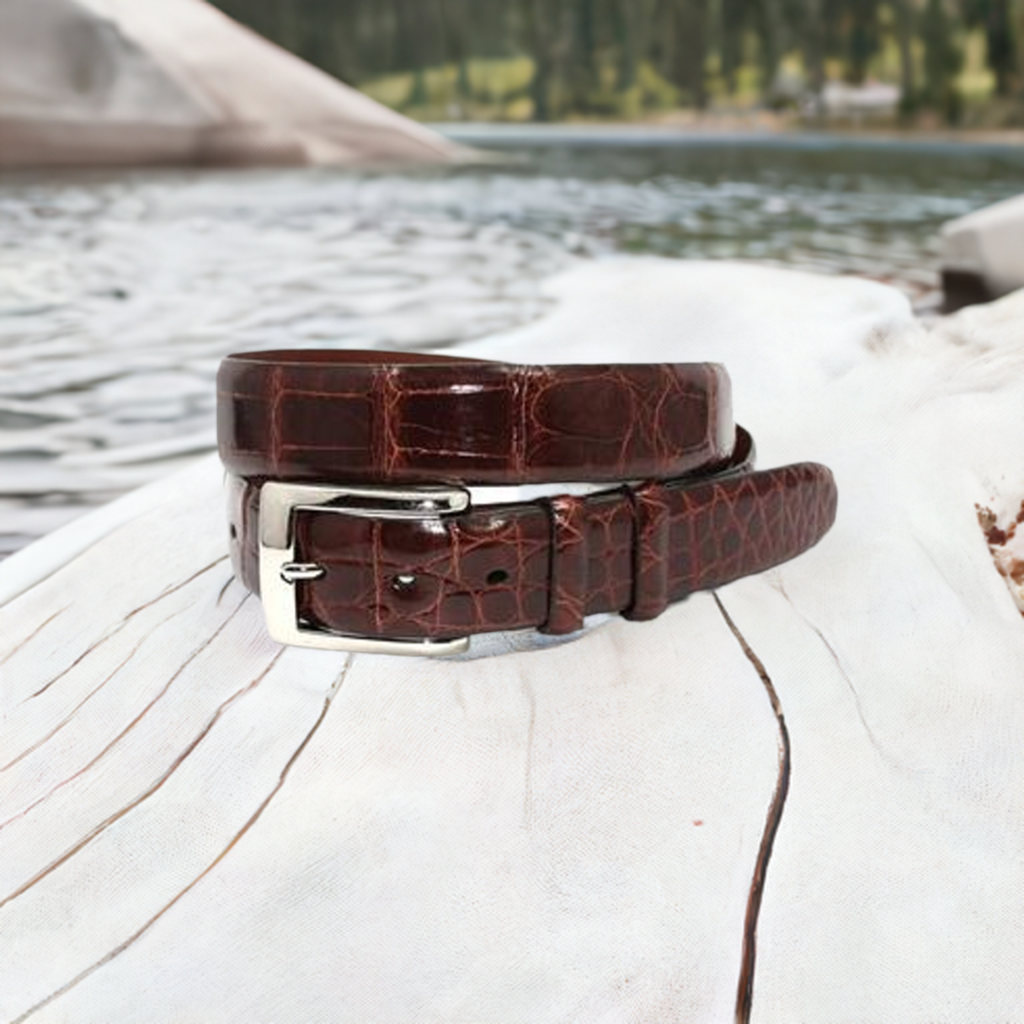 Genuine glazed American alligator lined with glove leather, polished nickel on brass buckle. Buckle end has snaps for buckle removal. 30mm wide, made in the USA.