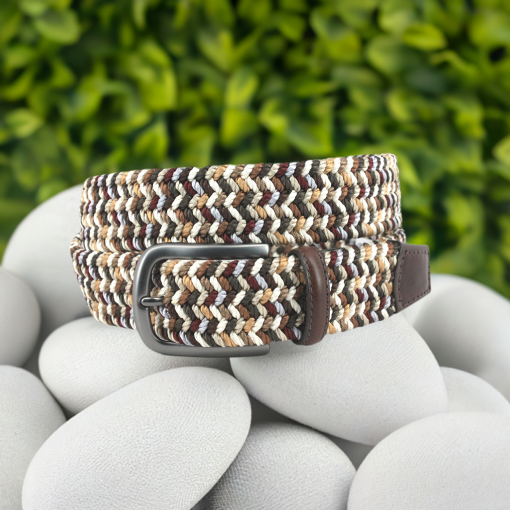 This Italian woven multi-hued belt is an essential for completing any look that requires tan, brown, or neutral bottoms. Crafted with a stretchy cotton base, a brushed buckle, and a leather trim, it's a high-quality piece proudly made in the USA.