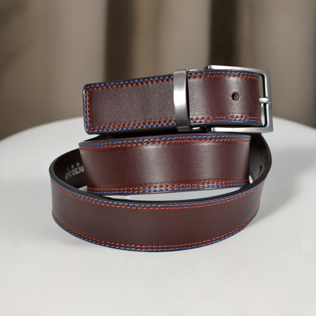 Stand out in style with the B27 Chocolate 2 Stitch Belt. This stylish accessory comes with a classic brown leather base, a trendy 2 color raised stitch in red and royal, and a shiny nickel buckle to complete the look. Perfect for all occasions, you'll be able to choose the perfect size ranging from 32 to 44.