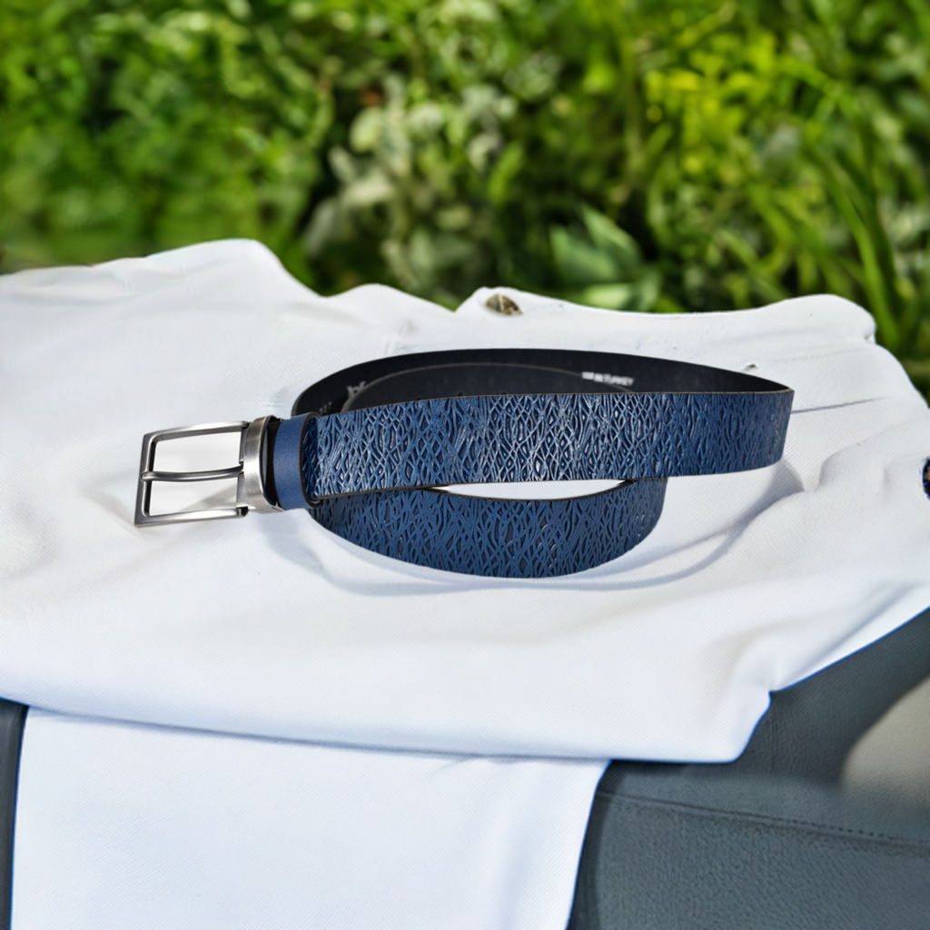 Crafted from Marcello leather, this belt's abstract weave-like stamps make a luxe yet subtle statement! Upon close inspection you will see the intricate details of a leather stamped weave. With a brushed nickel buckle, it's available in sizes 32 - 40 and the shades of Brown or Indigo.