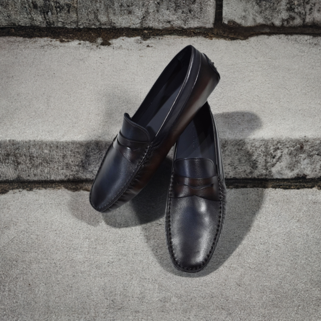 Our S121 Burnished Leather Driver is a masterpiece of both craftsmanship and style. The rich, burnished chocolate and navy leather mix creates a luxurious and elegant look, suitable for dressing up or dressing down. Hand-crafted in Spain and designed with a rubber sole that extends to the back heel, this shoe stands out with its classic fit and color combination that pairs timelessly with any bottoms.