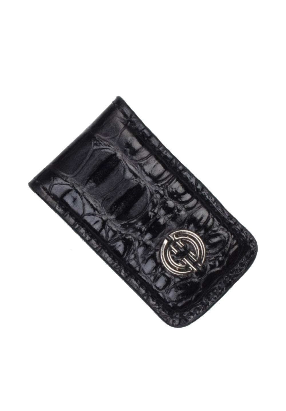 Keep it simple, yet cool, with this soft leather stamped hornback croc pattern. Black shaded croc stamp. Genuine leather over metal clamp. Perfect to travel light and keep your valuables in your front pocket. By Marcello Sport