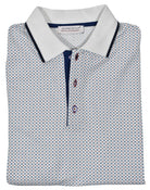 Soft, white, cotton pique fabric sporting a fine small geometric medallion in blue, teal and white colors, that creates a sophisticated clean image perfect for any setting.  Clean collar tipped in contrast color, custom buttons and contrast color fabric along the buttons.  Classic fit.