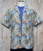 Choose this lightweight cotton and viscose shirt for your casual lifestyle.  Whether layered or alone, it is a great choice to enhance your fashion style.  Soft cotton and viscose fabric. Square bottom style with side slits. Camp model collar adds casual style. Modern fit for a slim to medium build.  Print shirt by Marcello Sport.