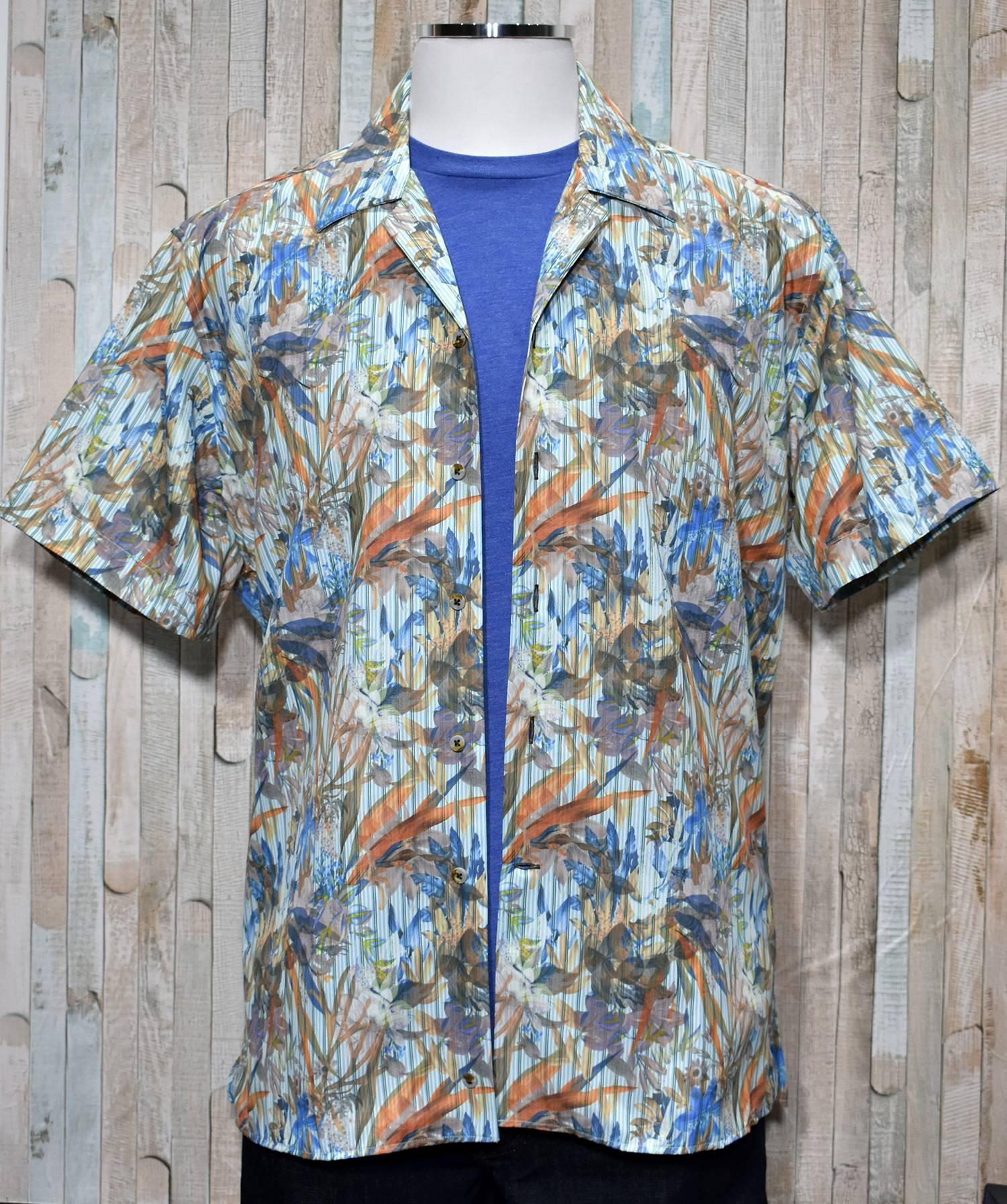 Choose this lightweight cotton and viscose shirt for your casual lifestyle.  Whether layered or alone, it is a great choice to enhance your fashion style.  Soft cotton and viscose fabric. Square bottom style with side slits. Camp model collar adds casual style. Modern fit for a slim to medium build.  Print shirt by Marcello Sport.