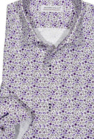Exclusive Marcello 1 Piece Roll Collar Shirt.  The one piece roll collar stands perfectly and looks fantastic alone or under a sport coat.  The classic lilac open paisley pattern coupled with a rich tonal herringbone fabric creates a sophisticated look to set your apart from the rest.  Hand selected buttons, two button cuff placket for the best look when rolling up the cuffs and enhanced stitch detailing.  Classic shaped fit.