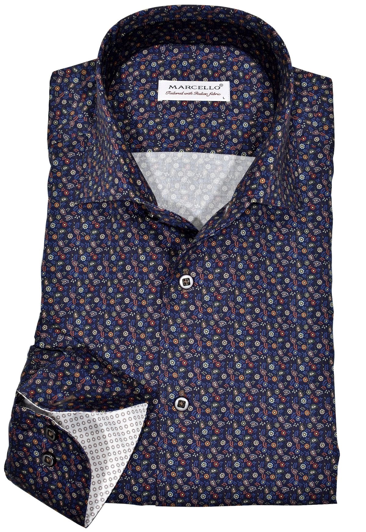 Exclusive Marcello 1 Piece Roll Collar Shirt.  The one piece roll collar stands perfectly and looks fantastic alone or under a sport coat.  The multi navy paisley pattern coupled with a rich fabric creates a sophisticated look to set your apart from the rest.  Hand selected buttons, two button cuff placket for the best look when rolling up the cuffs and enhanced stitch detailing.  Classic shaped fit.