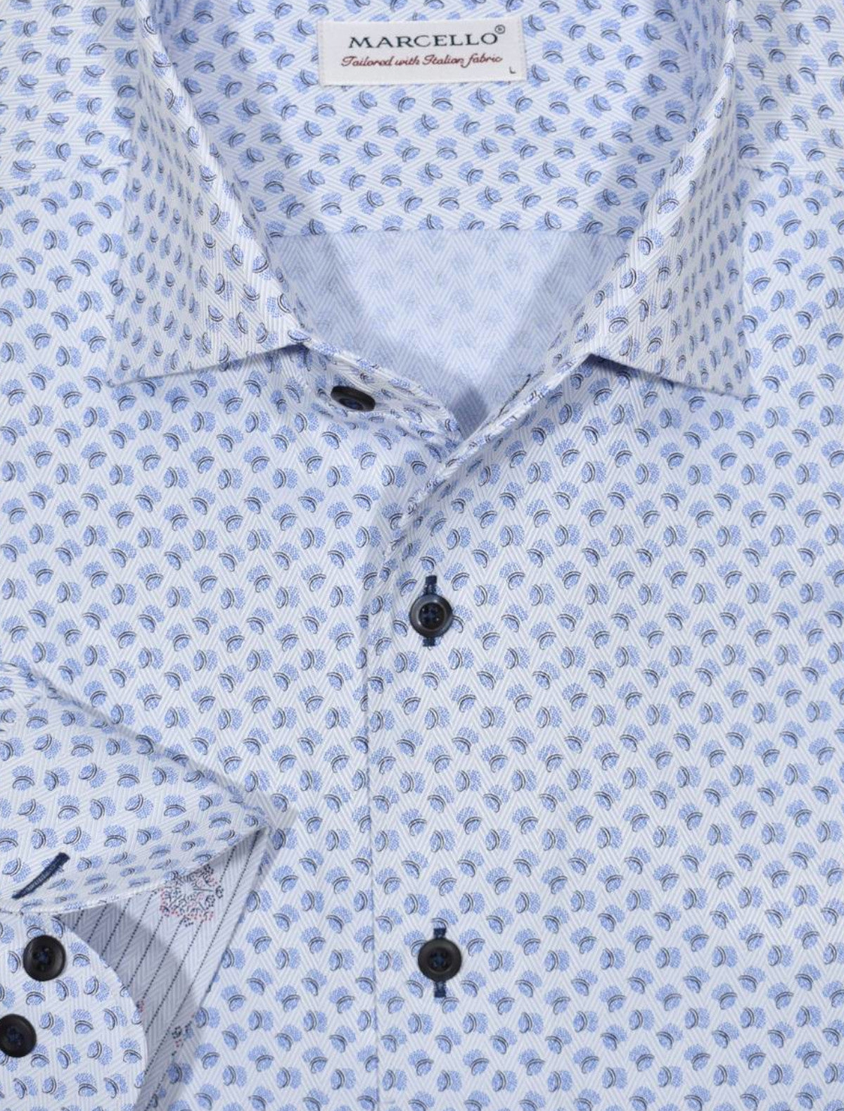 The ultimate, Marcello one piece roll collar, where the collar stands perfectly. The cotton microfiber fabric sports a rich and fine soft blue herringbone pattern that feels great to the touch.  The abstract print pattern with navy and blue shades creates a fashion look perfect for denims or under a navy sport coat.   Details include custom selected buttons, fashion cuff trim fabric and fine stitching.   Classic shaped fit.