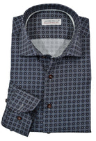 The charcoal and wine medallion pattern with light highlights is an exceptionally rich pattern to foster a debonair image when paired with black or charcoal bottoms.  The fabric is soft to the touch, consisting of cotton with a touch of lycra to provide diagonal stretch. The result is a luxurious feel with a little stretch for added comfort.  Accent silver taping in the neck and down the button placket.  Custom matched buttons.  Classic shaped fit.