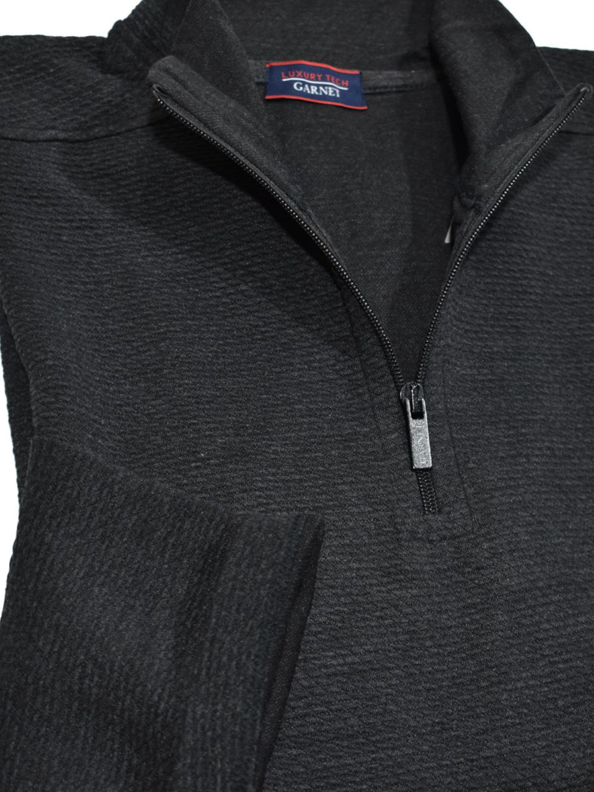 Luxury tech fabric is lightweight and cool with a finish that feels like soft velour. Classic zip mock model with an open bottom and open sleeve for a cool, contemporary image.   Light weight.  Classic shaped fit.