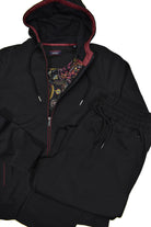 The ultimate in leisure set style, this black set features a soft cotton microfiber fabric with a contemporary hoodie style top.  Side slash pockets on the jacket and pant have an extra fine zipper closure and both the pant and jacket have draw string functionality.    Jacket sports a fashion lining for added style.  Pant has a full stretch waist band and classic pockets, all with fine zipper closure.  Open bottom pants, non functioning fly.  Modern fit, perfect for a medium to slim build.